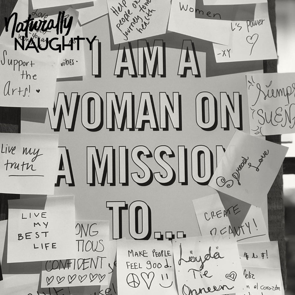 Wand mit Post-It Stickern und dem Spruch "I am a woman on a mission to..."